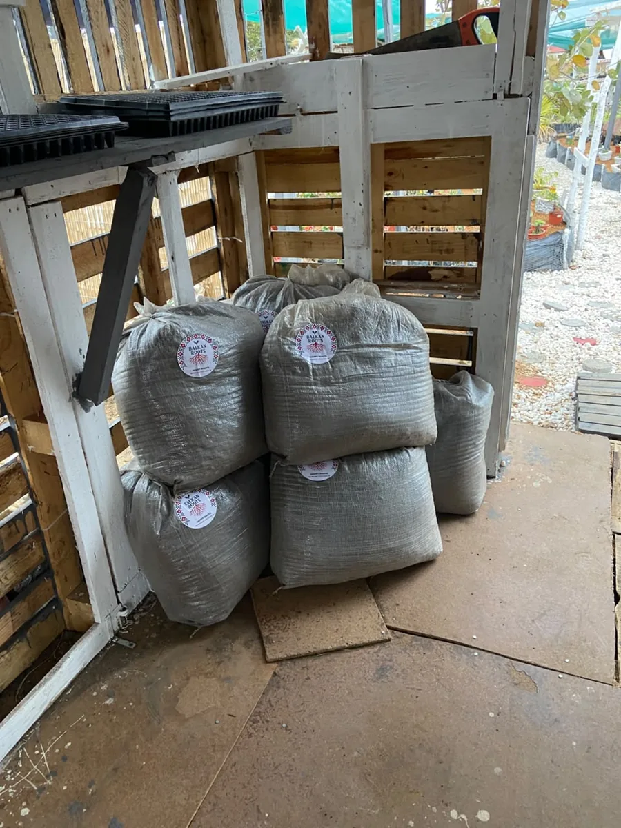 Packed Happy Roots bags stored at a local nursery location